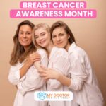 Three women embracing each other, symbolizing support during Breast Cancer Awareness Month